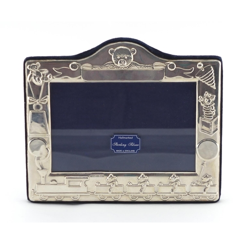 2463 - Rectangular silver easel photo frame embossed with teddy bears and toys, by Kitney & Co, boxed, 15cm... 