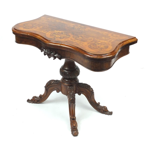 2002 - Victorian inlaid walnut folding card table, with serpentine front and floral carved knees, 70cm H x ... 