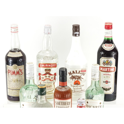 2309 - Nine bottles of spirits including Southern Comfort, Bacardi, Greenall's gin and Smirnoff vodka