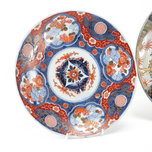 2176 - Three Japanese imari porcelain plates each hand painted with panels of flowers, the largest 31cm in ... 