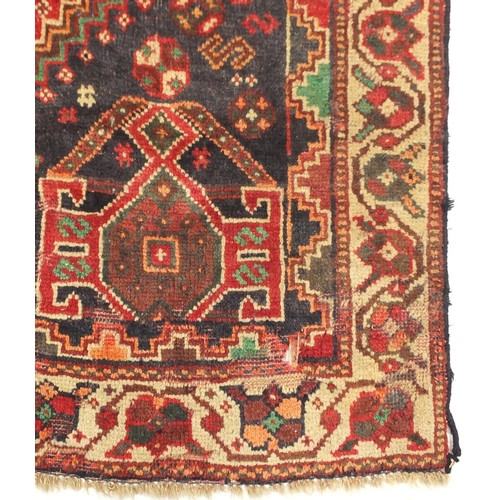 2010 - Rectangular Persian rug having an all over geometric motifs onto a predominantly red ground, 241cm x... 