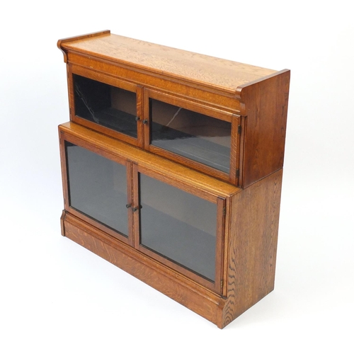 2022 - Oak two tier bookcase with glazed opening doors, 85cm H x 89cm W x 31.5cm D