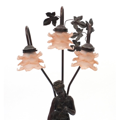 2220 - Art Nouveau style three branch figural table lamp with frilled frosted peach glass shades, 84cm high