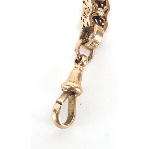 2616 - Victorian 9ct gold watch chain with T-bar and a gilt metal enamelled locket, 37cm in length, approxi... 
