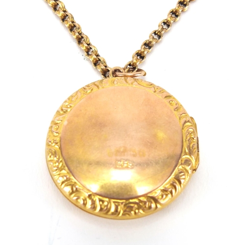 2623 - Victorian 9ct gold locket set with a central diamond, on a 9ct gold necklace, the locket 2.8cm in di... 