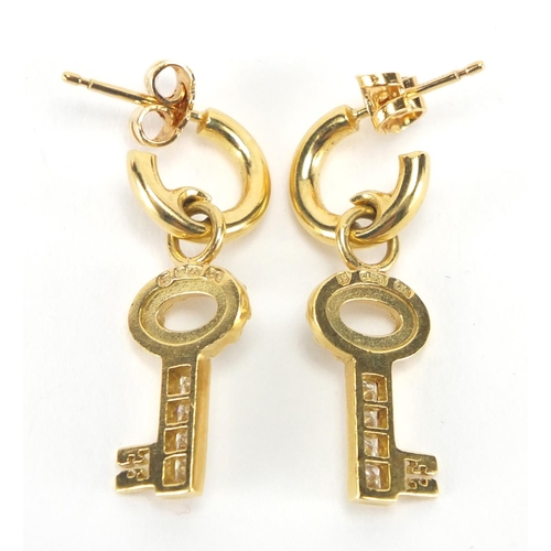 2604 - Pair of 18ct gold and diamond key design earrings by Theo Fennell, 3cm in length, approximate weight... 