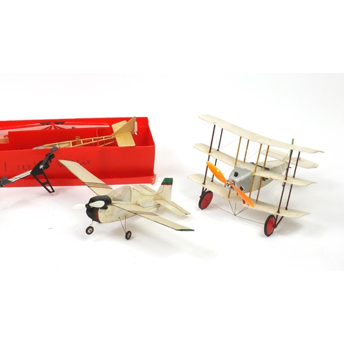 2418A - Four remote control model aeroplanes and a helicopter