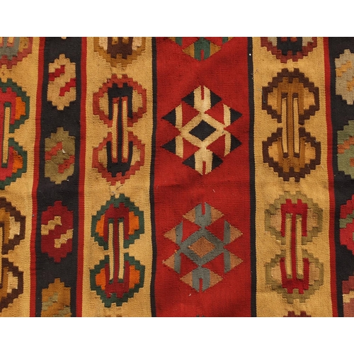 2020 - Turkish Kilim rug, having an all over stylised design onto a predominantly beige ground, 225cm x 157... 