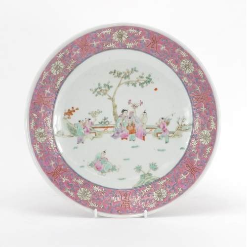 2179 - Chinese porcelain shallow dish, hand painted in the famille rose palette with panels of figures in a... 