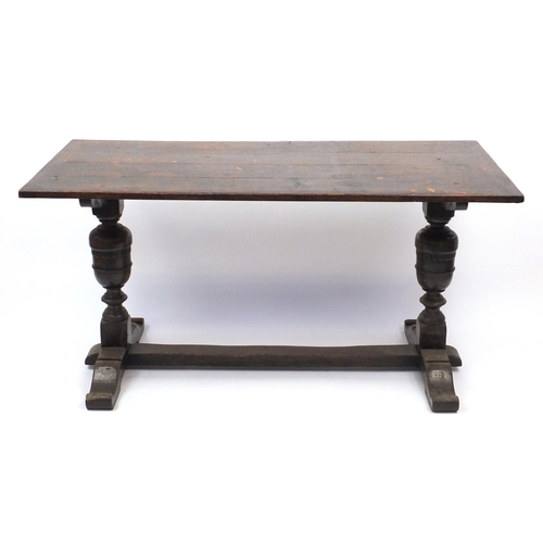 37 - Oak dining table, with carved acorn supports, 77cm H x 152cm W x 71cm D