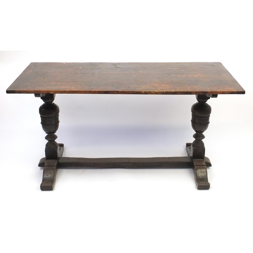 37 - Oak dining table, with carved acorn supports, 77cm H x 152cm W x 71cm D