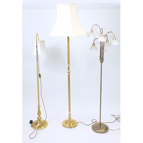 50 - Three brass standard lamps, one with glass shades