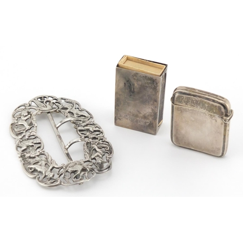 2490 - Silver objects comprising a Victorian buckle with cherubs and swans, rectangular vesta and matchbox ... 