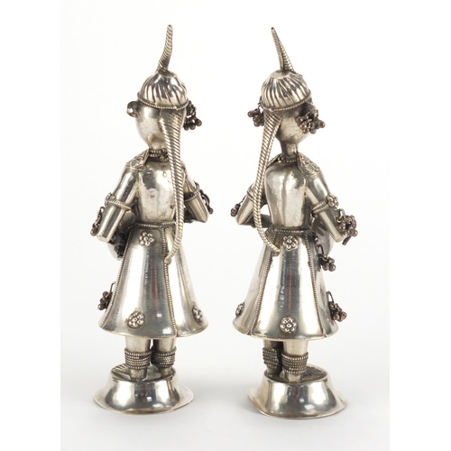 2498 - Pair of Middle Eastern unmarked silver musicians, one with paper labelto the base, the largest 19cm ... 