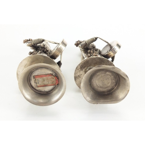 2498 - Pair of Middle Eastern unmarked silver musicians, one with paper labelto the base, the largest 19cm ... 