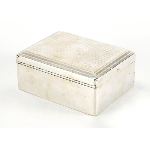 2501 - Rectangular silver cigarette box, the hinged lid with engine turned decoration, by William Neale & S... 