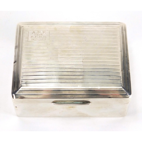 2501 - Rectangular silver cigarette box, the hinged lid with engine turned decoration, by William Neale & S... 