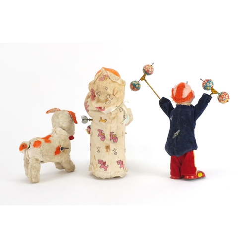 2259 - Three vintage tinplate toys including a Japanese baby playing a xylophone, the largest 22.5cm high