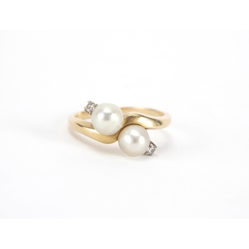 2639 - 14ct gold pearl and diamond crossover ring, size P, approximate weight 4.3g