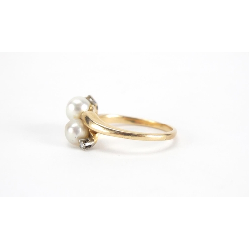 2639 - 14ct gold pearl and diamond crossover ring, size P, approximate weight 4.3g