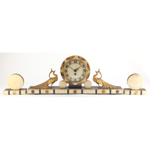 2133 - Art Deco black slate and marble mantel clock with garnitures, the mantel clock mounted with two styl... 