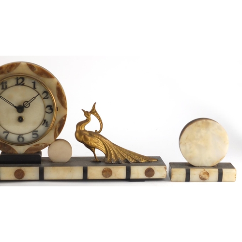 2133 - Art Deco black slate and marble mantel clock with garnitures, the mantel clock mounted with two styl... 