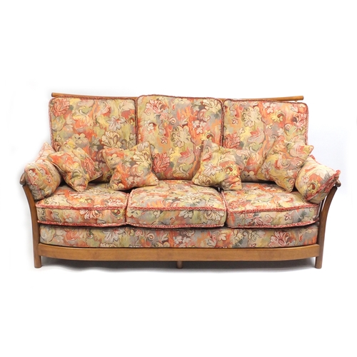 2 - Ercol Renaissance three seater settee, with floral upholstered lift off cushions, approximately 190c... 