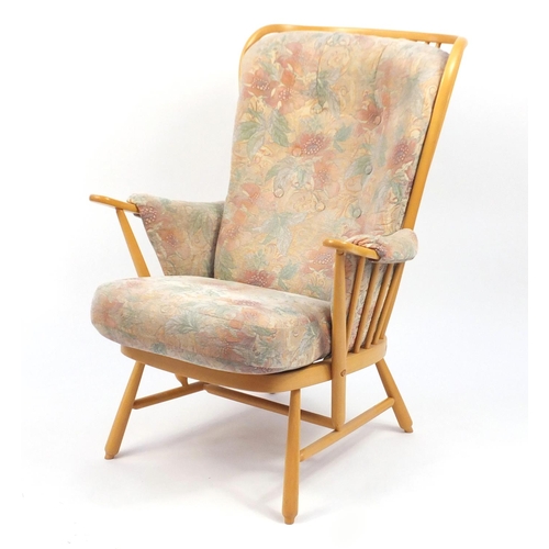 27 - Ercol light elm Evergreen stick back armchair, with floral button back upholstery, 102cm high