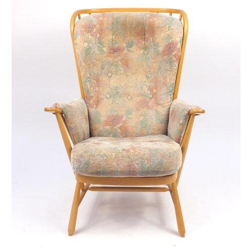28 - Ercol light elm Evergreen stick back armchair, with floral button back upholstery, 102cm high
