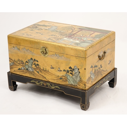 2008 - Chinese lacquered chest with twin handles on stand, hand painted with figures and a river landscape,... 