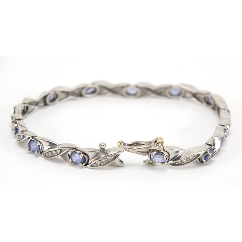 2614 - 14ct white gold sapphire and diamond bracelet, housed in a Collingwood tooled leather box, 18cm in l... 
