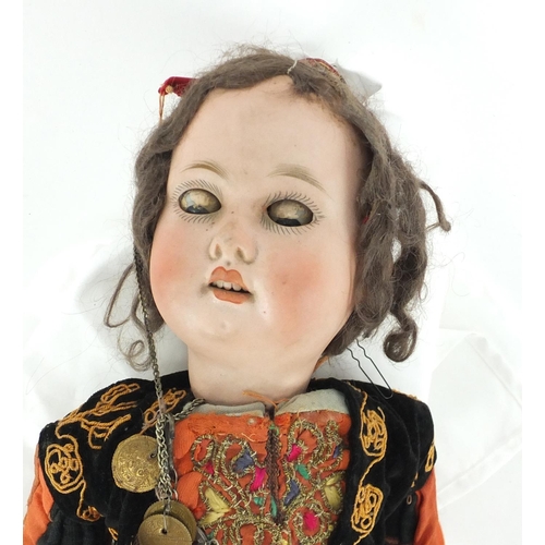 161 - German bisque headed doll in Eastern dress, impressed numbers D9 to the back of the head, 50cm high