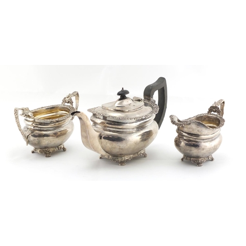 600 - Silver three piece tea service, the sugar bowl and jug with fox head handles, by George Nathan & Rid... 