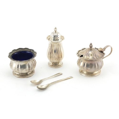 643 - Silver three piece cruet with blue glass liners by William Suckling Limited, Birmingham 1926, housed... 