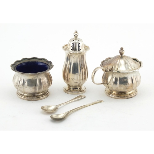 643 - Silver three piece cruet with blue glass liners by William Suckling Limited, Birmingham 1926, housed... 