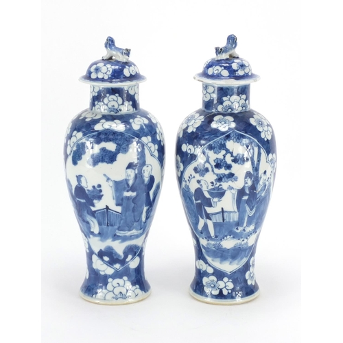 321 - Pair of Chinese blue and white baluster vases and covers, each hand painted with figures and Prunus ... 