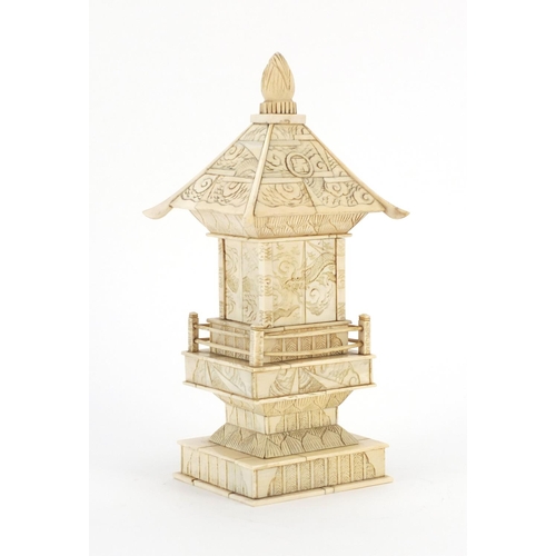 413 - Chinese carved ivory pagoda enclosing a figure of Buddha, 25.5cm high