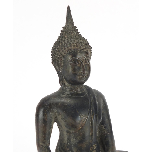 463A - Thai patinated bronze figure of seated Buddha, 24cm high