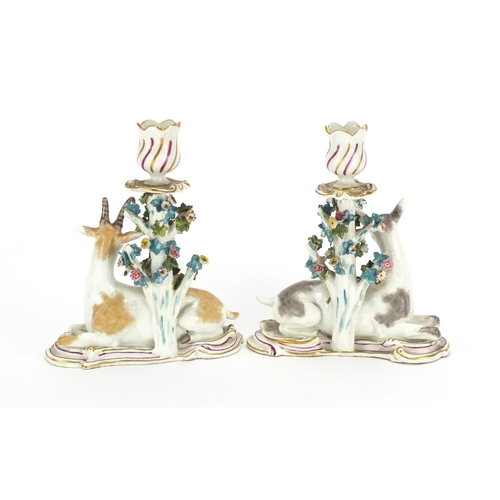 499 - Pair of 19th century hand painted porcelain candlesticks, modelled with goats, anchor marks to the r... 