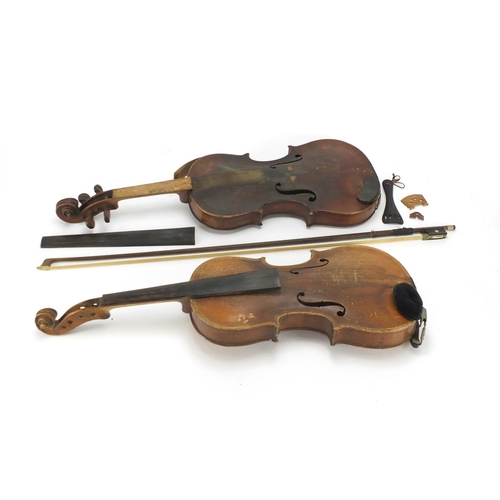 26 - Two old wooden violins, one with bow and carrying case, one violin with one piece back the other bea... 