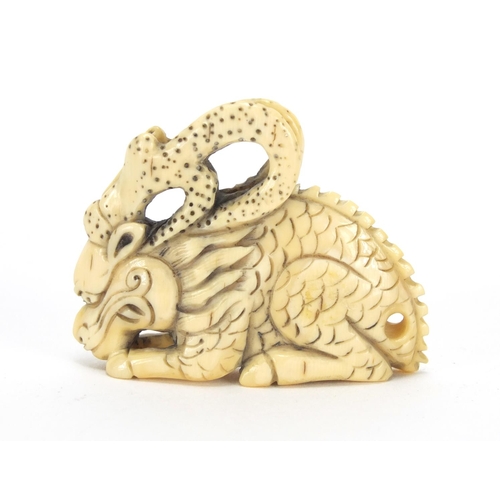 427 - ** WITHDRAWN FROM SALE ** Japanese carved ivory netsuke of a dragon, character marks to the base, 4.... 