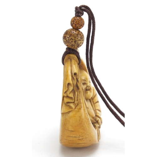429 - Japanese carved ivory netsuke of Buddha, 5cm wide