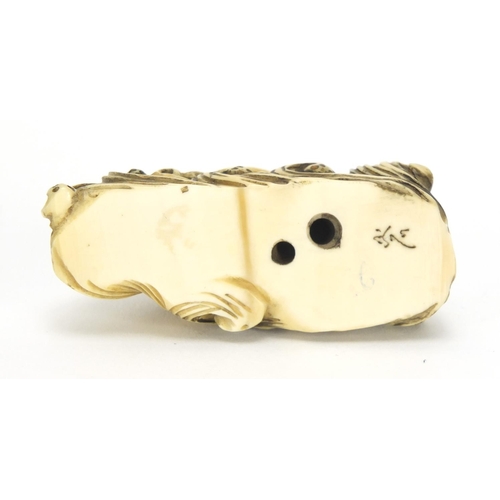 418 - ** WITHDRAWN FROM SALE ** Japanese carved ivory netsuke of a tortoise on waves, character marks to t... 