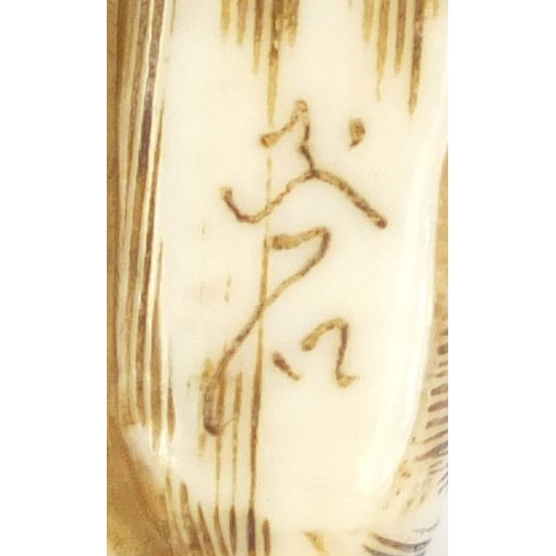 435 - Japanese carved ivory netsuke of a two rabbits, character marks to the base, 3.7cm high