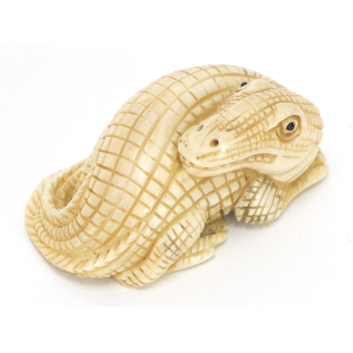 428 - ** WITHDRAWN FROM SALE ** Japanese carved ivory netsuke of a crocodile, character marks to the base,... 