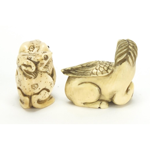443 - ** WITHDRAWN FROM SALE ** Two Japanese carved ivory netsuke's one of two frogs the other of Pegasus,... 