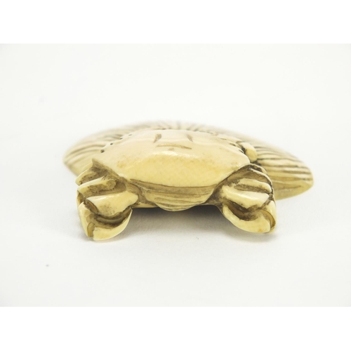 423 - Japanese carved ivory netsuke of a crab and shell, character marks to the base, 5cm wide