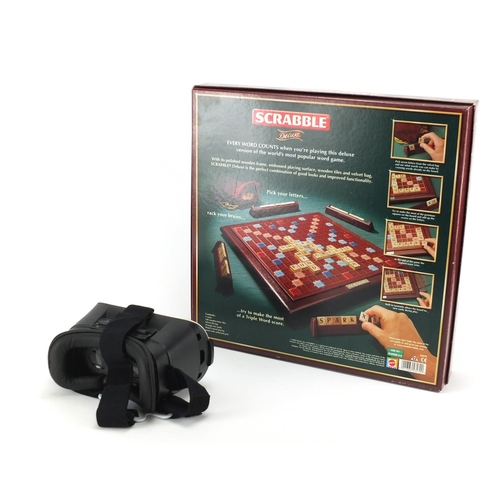 450 - Scrabble Deluxe board game and a set of virtual reality glasses