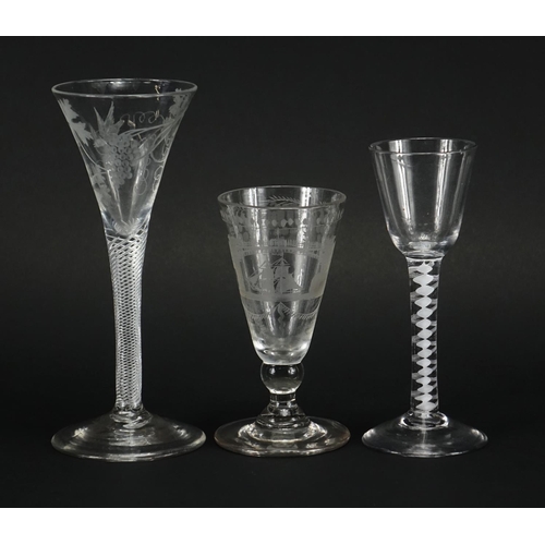 510 - Three antique glasses, two with air twist stems and one etched with a rigged ship under a bridge, th... 
