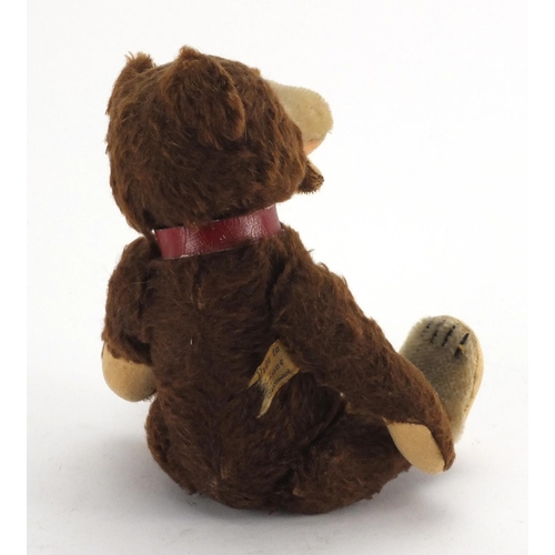 441 - Vintage German straw filled teddy bear, with glass bead eyes and articulated limbs, 22cm high